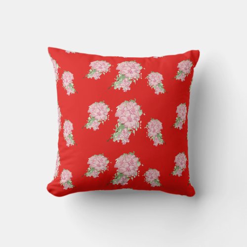Pink flowers on red throw pillow