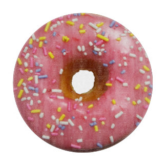 Pink glazed donut with sprinkles cutting board