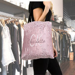Pink glitter drips monogram elegant script tote bag<br><div class="desc">A pink faux metallic looking background. Decorated with faux glitter drips,  paint dripping look. Personalize and add your  name,  monogram initials.  Your monogram as background pattern. The name is written with a hand lettered style script.</div>