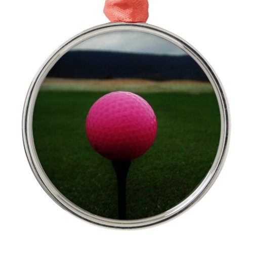 Pink Golf Ball on a mountain golf course Metal Ornament