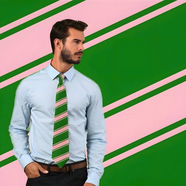 Pink & Green Thick and Thin Diagonal Stripes Tie (Man wearing Pink & Green Thick and Thin Diagonal Stripes Tie. He stands against patterned background)