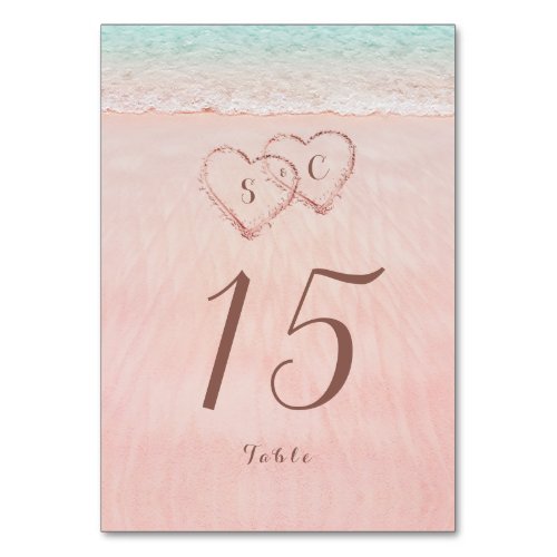 Pink hearts in the sand destination beach wedding table number