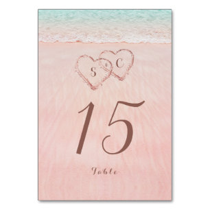 Pink hearts in the sand destination beach wedding table number