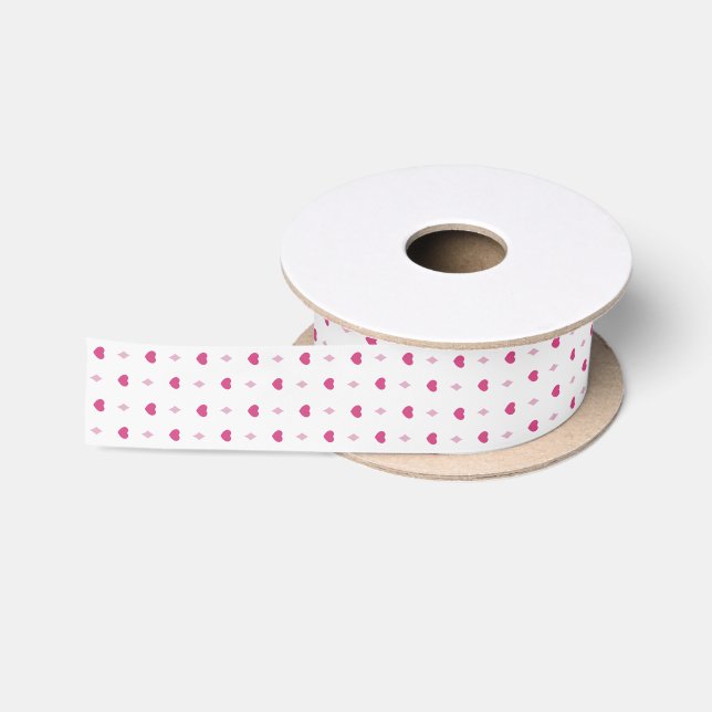 Pink hearts on white satin ribbon for wrapping. (Spool)