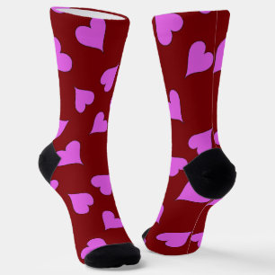 Pink hearts pattern on red socks