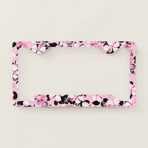 Pink hibiscus with black leaves license plate frame