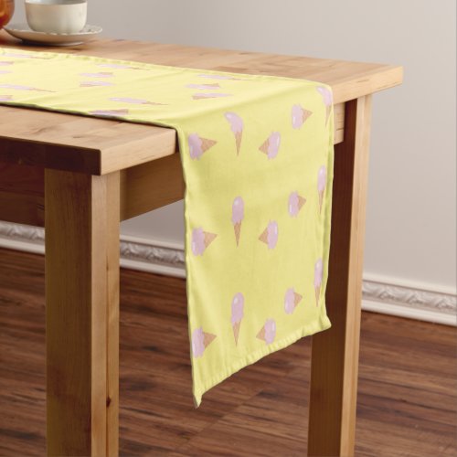 Pink ice creams on yellow short table runner