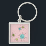 Pink Iconic Atomic Starbursts Keychain<br><div class="desc">This Pink Iconic Atomic Starbursts Keychain pattern features iconic atomic starbursts. That’s right! The old school, First Lady Pink colored background with gold speckles is the perfect backdrop for the vibrant turquoise, soothing celery, and kitschy pear green colored circles. The spots of color are sporadically placed in various sizes with...</div>