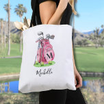 Pink Initial Name Monogram Tote Bag<br><div class="desc">This cute tote bag features a stylish pink watercolor golf bag filled with clubs, sitting on a patch of green grass. The design appears on both the front and back of the tote, so it looks great from any angle. A simple serif initial monogram is placed directly on the golf...</div>