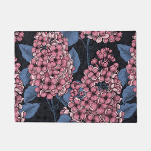 Pink lilac on dark blue doormat