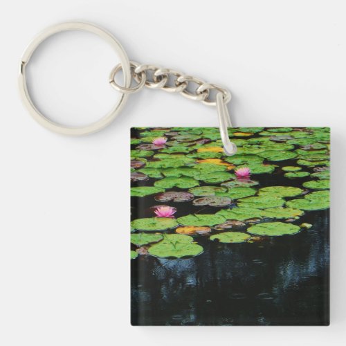 pink lotus black water keychain