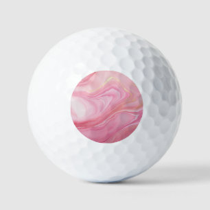 Pink marbled background golf balls