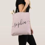 Pink Personalized Script Name Tote Bag<br><div class="desc">Chic pink and black personalized labeled tote bag with custom white name or any text for bridesmaid gifts, bachelorette parties, birthday favors, and girls trip keepsakes, and graduation gift for cute college and dorm room storage. Perfect for sports and hobby gear storage and transport. Colors and fonts are editable, just...</div>