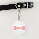 Pink Polka Dots And Dog Bone & Custom Pet Info Pet ID Tag<br><div class="desc">Blush pink small polka dots pattern together with a pink dog bone silhouette on the front. On the bone there is a personalizable text are for the name of the pet. The back has a personalizable text area for a phone number.</div>