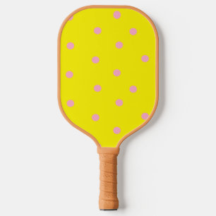 Pink polka dots on yellow pickleball paddle