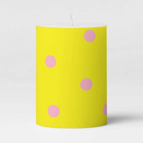 Pink polka dots on yellow pillar candle