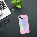 Pink purple holographic glitter drips name iPhone 15 case<br><div class="desc">A trendy holographic background with unicorn and rainbow pastel colors in pink,  purple,  rose gold,  mint green. Decorated with faux glitter drips in rose gold,  pink and purple. Personalize and add a name.   A bit of everyday glam to brighten up your day!</div>