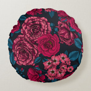 Pink, red and bi-color roses with blue leaves on b round pillow