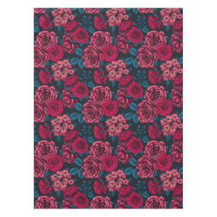 Pink, red and bi-color roses with blue leaves on b tablecloth