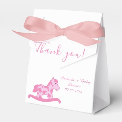 Pink Rocking Horse Baby shower Party favor box - A cute pink rocking horse baby shower party favor box. Thank you elegant script typography. Personalize the name and the date. Pink colors for a baby girl babyshower party celebration. Great party supplies for a new baby. Rocking horse themed favor box with a white background. There is a heart pattern on a back side of the favor box.