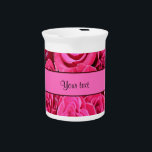 Pink Roses Drink Pitcher<br><div class="desc">A beautiful all over printed image of open pink roses. A pretty feminine floral design for women and girls. In the center is a matching colored name strip for you to personalize with the wording of your choice. PLEASE NOTE: All products on Zazzle have flat printed images. If you need...</div>