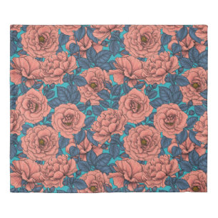 Pink roses with blue leaves on blue duvet cover