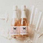 Pink She's Tying the Knot Sparkling Wine Label<br><div class="desc">Celebrate in style with these pink 'She’s Tying the Knot' mini champagne labels featuring a chic bow design. Perfect for bridal shower favors,  these elegant labels are customizable with the bride’s name and party details to add a personal touch. Check out our matching items</div>