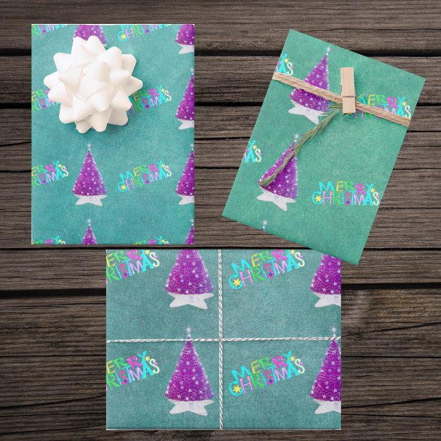 Pink Silver Trees Colourful Merry Christmas Text Wrapping Paper Sheets (Pink silver trees bright Merry Christmas on blues and green sheets of gift wrapping paper.)