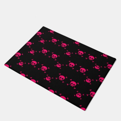 Pink skull and crossbones on black doormat