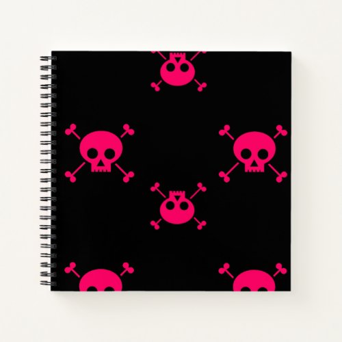 Pink skull and crossbones on black notebook
