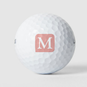 pink square with her own initial customized golf balls