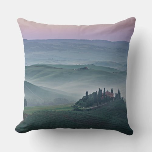 Pink sunrise over a Tuscany landscape pillow