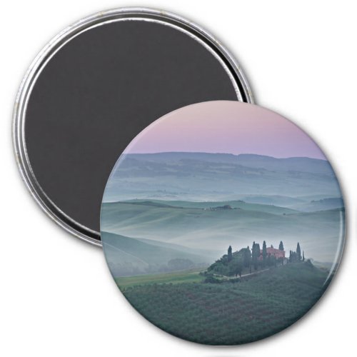 Pink sunrise over a Tuscany landscape round magnet