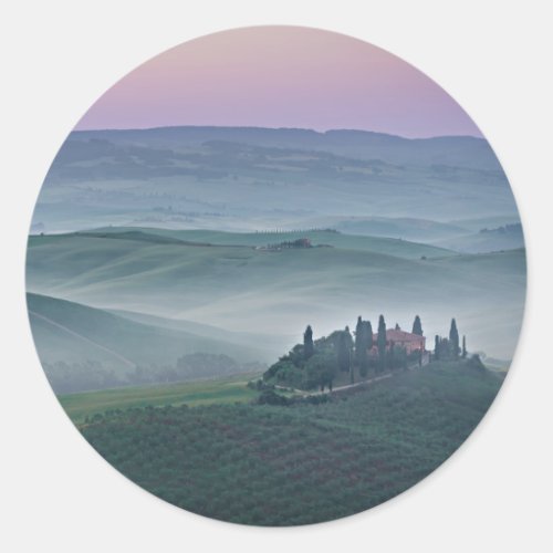 Pink sunrise over Tuscany landscape round sticker