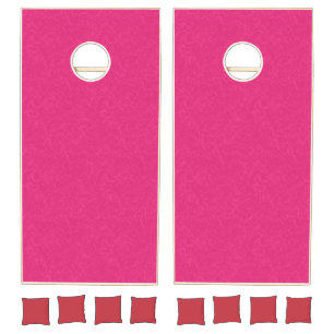 Pink textured surface with subtle swirling pattern cornhole set
