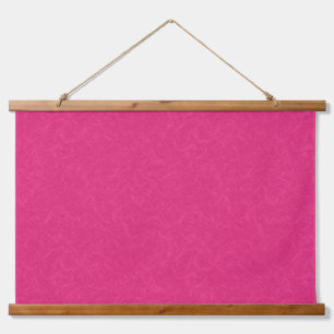 Pink textured surface with subtle swirling pattern hanging tapestry