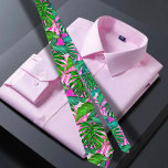 Pink Tropical Hawaiian pattern  Neck Tie<br><div class="desc">The Hawaiian print men's neck tie features a captivating illustration of green and pink tropical leaves, exuding a vibrant and eye-catching design. The tie showcases a harmonious blend of lush green leaves and vibrant pink accents, creating a visually striking combination. The green leaves symbolize the abundant foliage found in the...</div>
