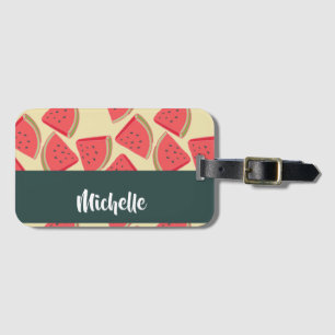 Pink watermelon slices on yellow luggage tag