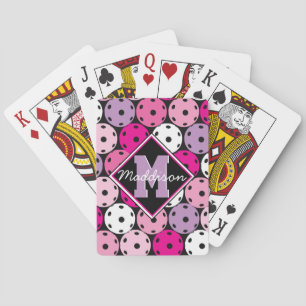 Pink, white and purple pickleballs, with name poker cards