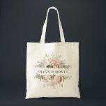 Pink White Floral Wedding Tote Bag<br><div class="desc">The wedding couple's names are surrounded by top and bottom borders of white hydrangea flowers and pink roses. There is a variety of leaves and branches that give it a very modern and chic vibe.</div>