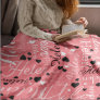 pink with a hint of white and black fleece blanket