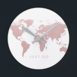 Pink World Map Globe Round Clock<br><div class="desc">Soft blush pink with a pastel rose gold effect world map design on a minimal modern wall clock with editable "just go" quote to inspire you to get out and see the world ... or as a reminder to get out the door so you can be on time! The elegant...</div>