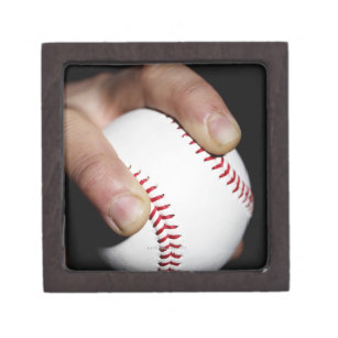 Pitchers hand gripping a baseball jewelry box