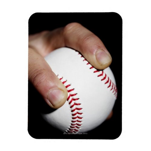 Pitchers hand gripping a baseball magnet