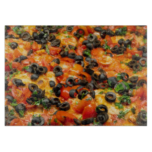 Pizza with black olives cutting board