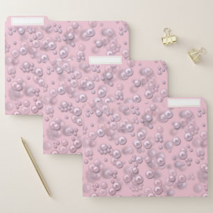 Placers of white-pink pearls on pink velvet file folder