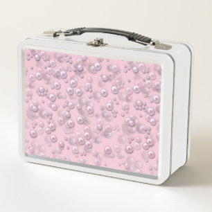 Placers of white-pink pearls on pink velvet metal lunch box