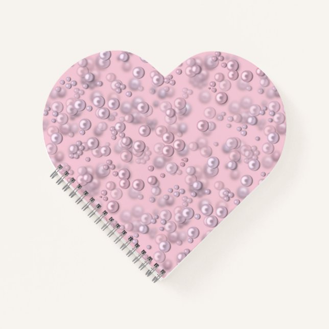 Placers of white-pink pearls on pink velvet notebook (Front)
