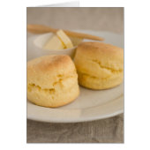 Plain scone with butter on plate (Front)