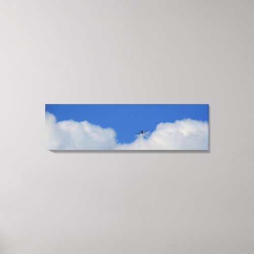 Plane With Clouds Panoramic Canvas Print